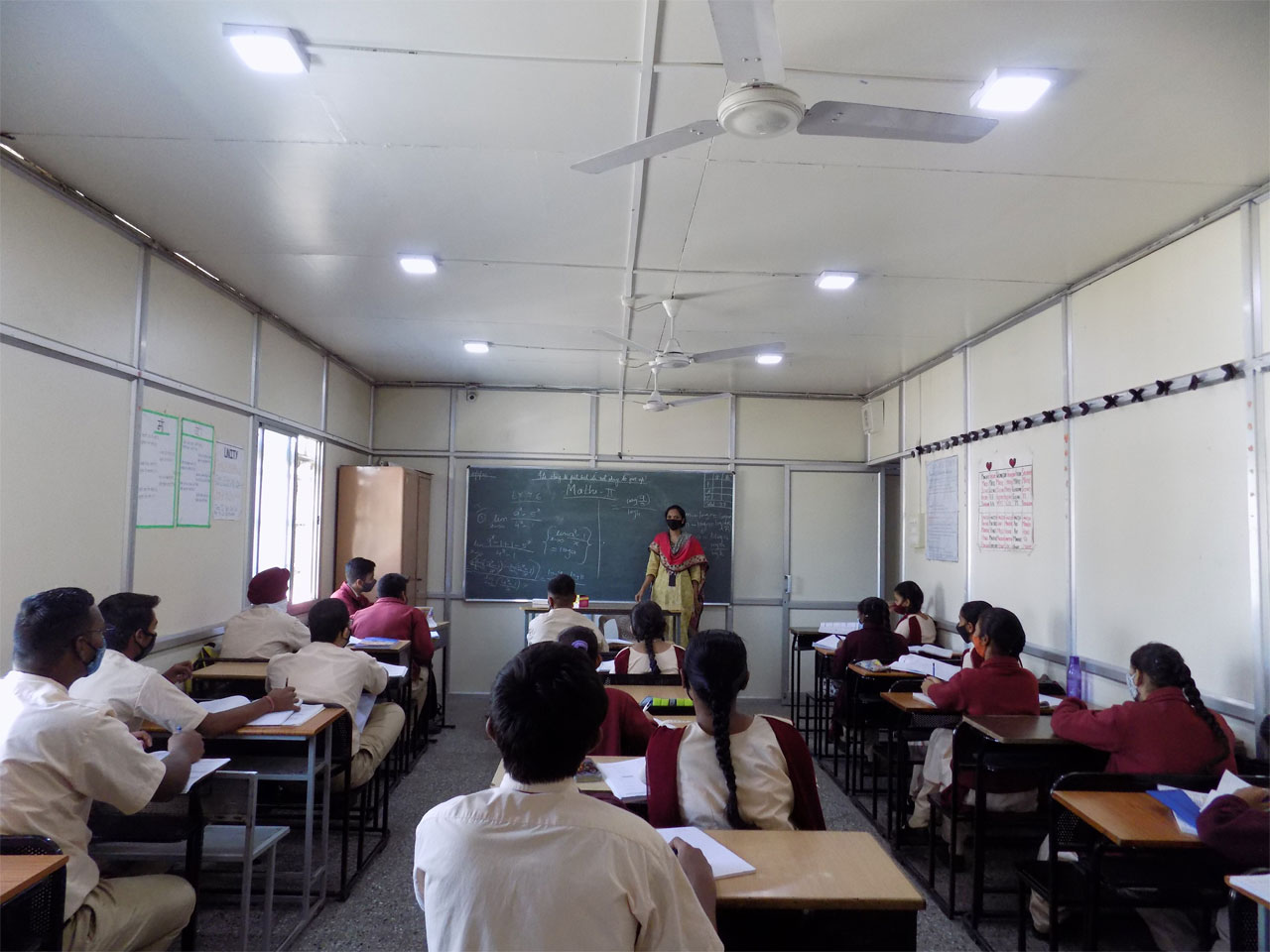 Children Studying In Classroom
